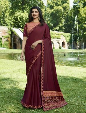 Bright And Visually Appealing Color IS Here With This Designer Saree In Dark Magenta Pink Color Paired With Contrasting Peach And Maroon Colored Blouse. This Saree IS Soft Silk Based Beautified With Heavy Embroidery over the Pallu. Its Fabric Ensures Superb Comfort Throughout The Gala.