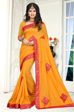 Celebrate This Festive Season with This Attractive Looking Musturd Yellow Colored Saree Paired With Musturd Yellow Colored Blouse. This Saree And Blouse are Fabricated On Soft Silk Beautified With Patch Work With Fancy Button And Tassels. 