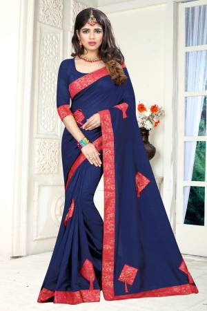 Enhance Your Personality Wearing This Designer Saree In Navy Blue Color Paired With Navy Blue Colored Blouse. This Saree And Blouse are Silk Based Beautified With Patch, Fancy Buttons And Tassels. Buy This Rich And Elegant Looking Saree Now.