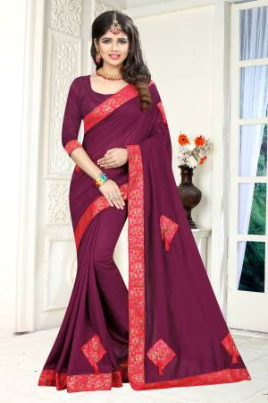 Add This Beautiful And Attractive Shade To Your Wardrobe With This Designer Saree In Wine Color Paired With Wine Colored Blouse. This Saree And Blouse are Fabricated On Soft Silk Which Gives A rich Look And Also It Is Comfortable To Carry Throughout The Gala.