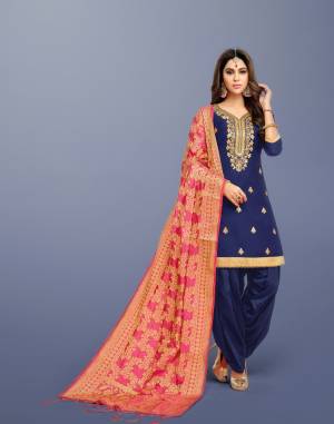 Enhance Your Personality In This Navy Blue Colored Suit Paired With Contrasting Pink Colored Dupatta. Its Is Silk Based Paired With Lawn Cotton Bottom and Banarasi Art silk Dupatta. All Its Fabric Ensures Superb Comfort All Day Long. 