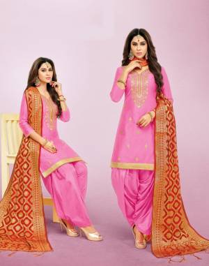 Add This Very Pretty Looking Suit To Your Wardrobe In Pink Color Paired With Contrasting Orange Colored Dupatta. Its Top Is Silk Based Paired With Lawn Cotton Bottom And Banarasoi Dupatta. Buy This Attractive Looking Suit Now.