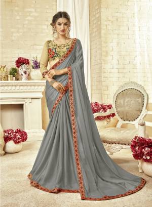 Rich and Elegant Looking Designer Saree Is Here In Grey Color paired With Cream Colored Blouse. This Saree IS Silk georgette Based Paired With Art Silk Fabricated Blouse. It Has Contrasting Thread Work Over The Blouse. Buy Now.