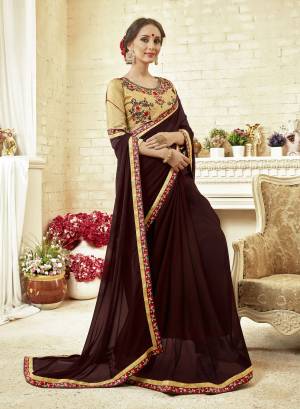 Flaunt Your Rich And elegant Taste Draping This Beautiful Designer Saree In Brown Color Paired With Cream Colored Blouse. This Saree Is Fabricated On Georgette Paired With Art Silk Fabricated Blouse. Buy This Designer Saree Now. 