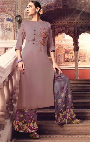 New Shade Is Here With This Designer Readymade Pair In Mauve Colored Top Paired With Purple Colored Plazzo. Its Top Is Fabricated On Muslin Silk Paired With Modal Satin Plazzo. Buy This Kurti Set Now.