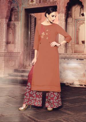 Add This Readymade Plazzo Set To Your Wardrobe In Rust Orange Colored Top Paired With Maroon Colored Bottom. Its Top IS Muslin Silk Fabricated Paired With Modal Satin Bottom. Buy Now.