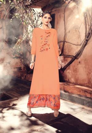 New Shade Is Here With This Designer Readymade Pair In Peach Colored Top Paired With Dark Peach Colored Plazzo. Its Top Is Fabricated On Muslin Silk Paired With Modal Satin Plazzo. Buy This Kurti Set Now.