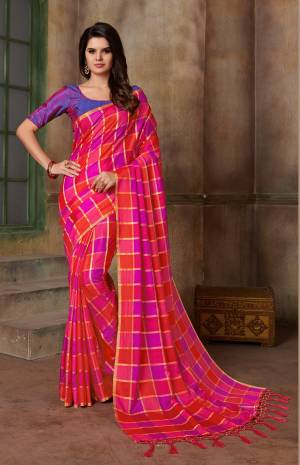 Look Pretty In This Pink Colored Saree Paired With Contrasting Violet Colored Blouse. This Saree And Blouse Are Silk Based Beautified With Checks Prints all Over It.