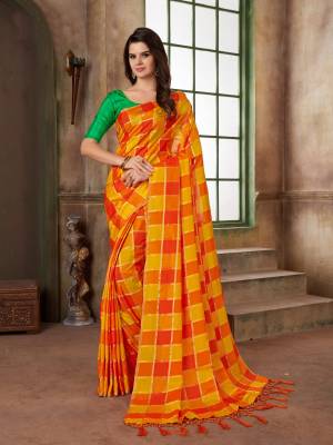 Grab This Pretty Checks Printed Silk Based Saree In Orange And Yellow Color Paired With Green Colored Blouse. This Saree And Blouse Are Fabricated On Art Silk In Two Tone.