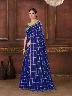 Shine Bright In This Bright Royal Blue Colored Saree Paired With Contrasting Green Colored Blouse. This Saree Is Fabricated On Soft Silk Paired With Art Silk Fabricated Blouse. Its Saree Is Beautified with Checks Prints And Blouse Has Beautiful Resham Work.