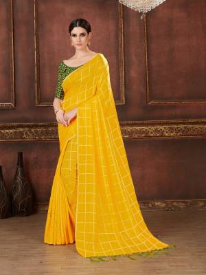 Celebrate This Festive Season Wearing This Designer Saree In Yellow Color Paired With Contrasting Green Colored Blouse. This Saree Is Silk Based Paired With Art Silk Fabricated Embroidered Blouse. Buy Now.