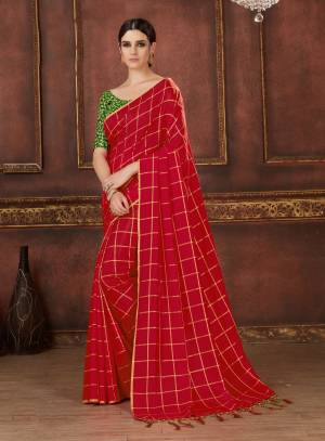 Adorn The Pretty Angelic Look Wearing This Designer Red Colored Saree Paired With Contrasting Green Colored Blouse, This Saree Is Fabricated On Soft Silk Paired With Art Silk Fabricated Blouse. Buy This Saree Now.