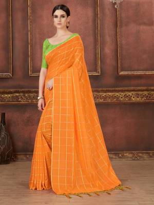 Celebrate This Festive Season Wearing This Designer Saree In Orange Color Paired With Contrasting Light Green Colored Blouse. This Saree Is Silk Based Paired With Art Silk Fabricated Embroidered Blouse. Buy Now.