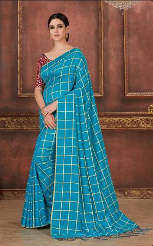 Look Pretty In This Turquoise Blue Colored Saree Paired With Contrasting Wine Colored Blouse, this Saree Is Fabricated On Soft Silk Paired With Art Silk Fabricated Blouse. Its Pretty Color Pallete And Elegant Design Will Earn You Lots Of Compliments From Onlookers.