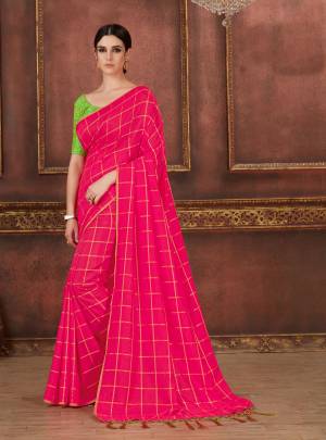 Shine Bright In This Bright Rani Pink Colored Saree Paired With Contrasting Parrot Green Colored Blouse. This Saree Is Fabricated On Soft Silk Paired With Art Silk Fabricated Blouse. Its Saree Is Beautified with Checks Prints And Blouse Has Beautiful Resham Work.