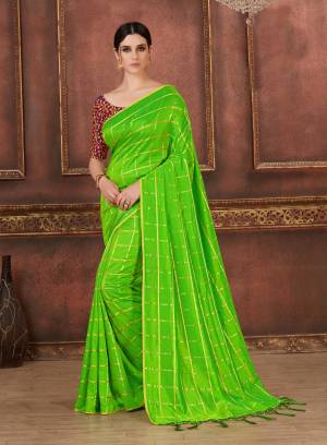 Appealing Color Is Here With This Saree In Parrot Green Color Paired With Contrasting Wine Colored Blouse. This Saree Is Fabricated On Soft Silk Paired With Art Silk Fabricated Blouse. Buy This Saree Now.
