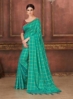 Look Pretty In This Sea Blue Colored Saree Paired With Contrasting Wine Colored Blouse, this Saree Is Fabricated On Soft Silk Paired With Art Silk Fabricated Blouse. Its Pretty Color Pallete And Elegant Design Will Earn You Lots Of Compliments From Onlookers.