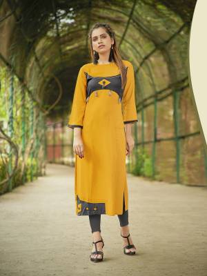 Grab This Pretty Elegant Looking Kurti For Your Semi-Casual Wear In Yellow Color Fabricated On Rayon. This Kurti Is Beautified with Buttons And Tassels And Available In All Regular Sizes.