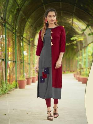 You Will Definitely Earn Lots Of Compliments Wearing This Designer Readymade Kurti In Grey And Maroon Color Fabricated On Rayon. This Pretty Kurti Is Beautified With patch Work And Buttons. 