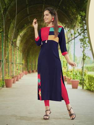 For Your Casual Or Semi-Casual Wear, Grab This Pretty Kurti In Navy Blue Color Fabricated On Rayon. It Has Multi Color Patch Work And Buttons.