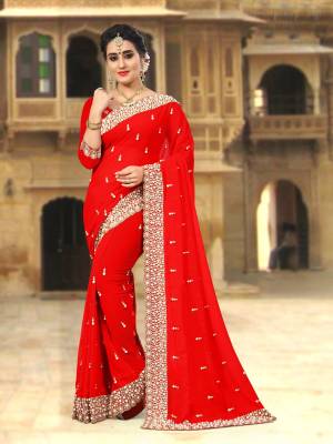 Adorn the Pretty Angelic Look Wearing This Saree Is Attractive Red Color Paired With Red Colored Blouse. This Saree And Blouse Are Fabricated On Georgette Beautified with Heavy Embroidery And Heavy Moti Work.