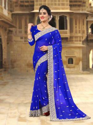 Bright And Visually Appealing Color Is Here With This Designer Saree In Royal Blue Color Paired With Royal Blue Colored Blouse. This Saree And Blouse are Georgette Based Beautified With Heavy Embroidered Lace Border. 