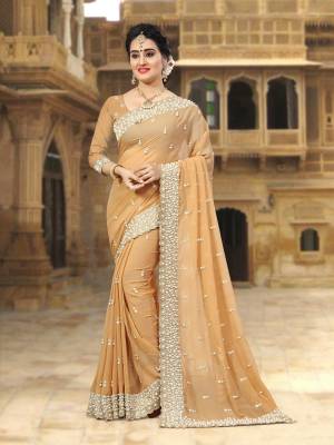 Simple And Elegant Looking Saree In Beige Color Paired With Beige Colored Blouse. This Saree and blouse Are Georgette Based Beautified with Heavy Embroidery. Buy Now.