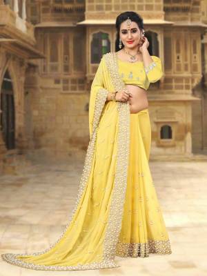 Adorn the Pretty Angelic Look Wearing This Saree Is Attractive Yellow Color Paired With Yellow Colored Blouse. This Saree And Blouse Are Fabricated On Georgette Beautified with Heavy Embroidery And Heavy Moti Work.