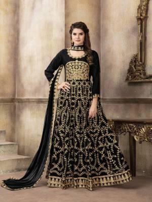 For A Bold And Beautiful Look, Grab This Heavy Designer Floor Length Suit In Black Color Paired With Black Colored Bottom And Dupatta. Its Top Is Art Silk Based Paired With Santoon Bottom And Net Dupatta. It Is Beautified With Heavy Jari Embroidery And Stone Work.