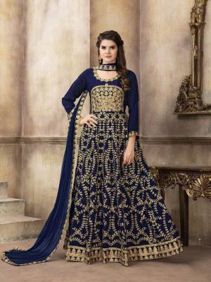 Enhance Your Personality Wearing This Designer Floor Length Suit In Navy Blue Color Paired With Navy Blue Colored Bottom And Dupatta. Its Top Is Art Silk Based Paired With Santoon Bottom And Net Dupatta. Buy Now.