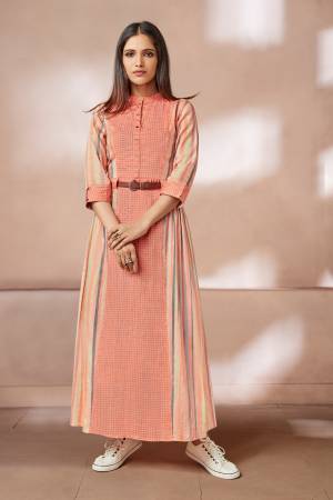 A Must Shade In Every Womens Wardrobe Is Here With This Designer Long Readymade Kurti In Peach Color Fabricated On Rayon Beautified With Prints All Over It. Its Fabric Ensures Superb Comfort All Day Long.