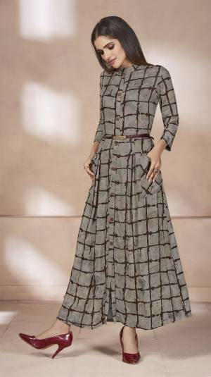 Flaunt Your Rich And Elegant Taste Wearing This Designer Readymade Long Kurti In Grey Color Fabricated On Rayon Beautified With Bold Checks All Over IT. This Kurti Is Light Weight And Easy To Carry All Day Long. 