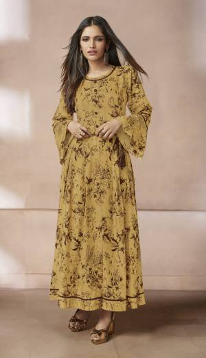 Celebrate This Festive With Ease And Comfort Wearing This Designer Readymade Long Kurti In Yellow Color Fabricated On Rayon. This Kurti Ensures Superb Comfort All Day Long And Available In All Sizes.