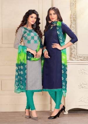 Here Is An elegant Looking Pair In Dress Material With Two Tops. Its Grey Top Is Fabricated On Cotton And Navy Blue Is Chanderi Based Paired With Turquoise Blue Colored Cotton Bottom And Chiffon Dupatta. Buy Now.