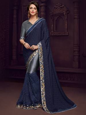 Bring out the best in you when wearing this Navy Blue color Designer imported fabrics saree. Ideal for party, festive & social gatherings. this gorgeous saree featuring a beautiful mix of designs. Its attractive color and designer imported heavy embroidered design, flower design and stone design, stone design, beautiful floral design work over the attire & contrast hemline adds to the look. Comes along with a contrast unstitched blouse.