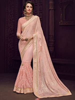 Vibrant and visually appealing, this Baby pink color Designer imported fabrics saree. Ideal for party, festive & social gatherings. this gorgeous saree featuring a beautiful mix of designs. Its attractive color and designer imported heavy embroidered design, flower patch design and moti design, stone design, beautiful floral design work over the attire & contrast hemline adds to the look. Comes along with a contrast unstitched blouse.