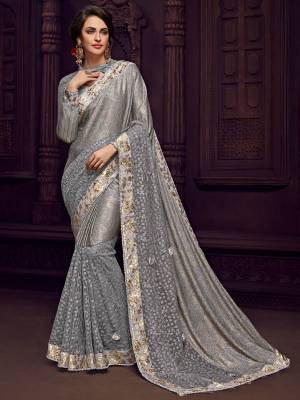The fabulous pattern makes this saree a classy number to be included in your wardrobe In Light grey color Designer imported fabrics saree. Ideal for party, festive & social gatherings. this gorgeous saree featuring a beautiful mix of designs. Its attractive color and designer imported heavy embroidered design, flower patch design and moti design, stone design, beautiful floral design work over the attire & contrast hemline adds to the look. Comes along with a contrast unstitched blouse.