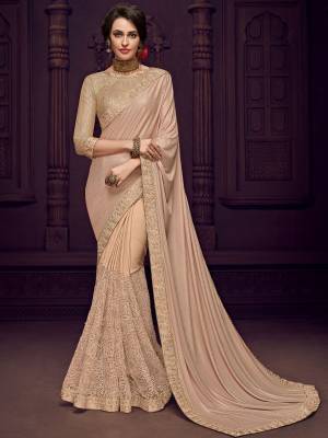 You Look elegant and stylish this festive season by draping this beige color Designer imported fabrics saree. Ideal for party, festive & social gatherings. this gorgeous saree featuring a beautiful mix of designs. Its attractive color and designer imported heavy embroidered design, flower patch design and moti design, stone design, beautiful floral design work over the attire & contrast hemline adds to the look. Comes along with a contrast unstitched blouse.