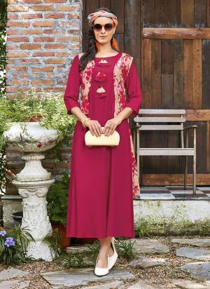 Shine Bright Wearing This Readymade Designer Kurti In Magenta Pink Color Fabricated On Rayon Beautified With Prints All Over. It Is Available In All Regular Sizes. Buy Now.