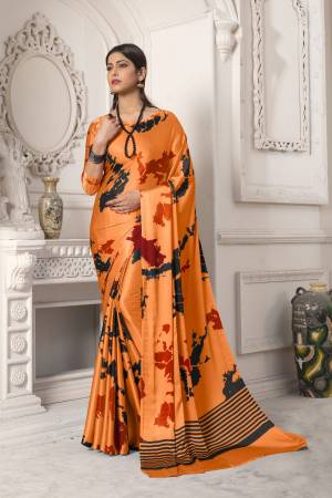 Look Pretty In This Orange Colored Saree Paired With Orange Colored Blouse, This Saree And Blouse Are Fabricated On Satin Silk Beautified With Abstract Prints All Over It. It Is Light Weight And Easy To Carry All Day Long. Buy Now.