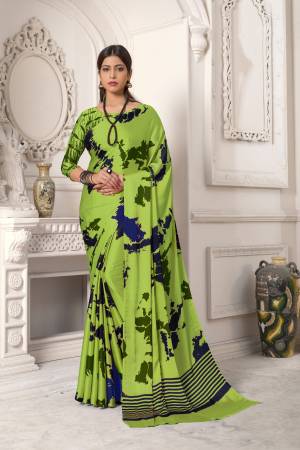 Look Pretty In This Green Colored Saree Paired With Green Colored Blouse, This Saree And Blouse Are Fabricated On Satin Silk Beautified With Abstract Prints All Over It. It Is Light Weight And Easy To Carry All Day Long. Buy Now.