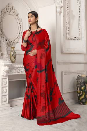 Look Pretty In This Red Colored Saree Paired With Red Colored Blouse, This Saree And Blouse Are Fabricated On Satin Silk Beautified With Abstract Prints All Over It. It Is Light Weight And Easy To Carry All Day Long. Buy Now.