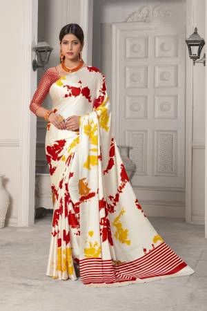 Simple And Elegant Looking Saree Is Here In White Color Paired With Red Colored Blouse. This Saree And Blouse Are Fabricated On Satin Silk Beautified With Multi Colored Prints Giving It An Attractive Look.