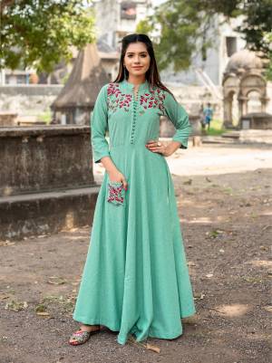 Grab All The Attention wearing This Designer Readymade Long Kurti In Very Pretty Sea Green Shade Fabricated On Cotton. It IS Beautified With Multi Colored Thread Work  Over The Yoke And Pocket. 