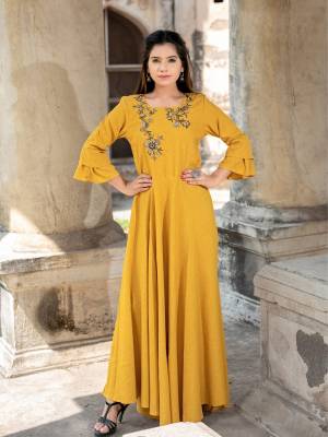 Celebrate This Festive Season With Ease And Comfort Wearing This Designer Readymade Long Kurti In Musturd Yellow Color Fabricated On Cotton. It Has Very Beautiful Bell Sleeve Pattern With Hand Work Over Its Yoke. 