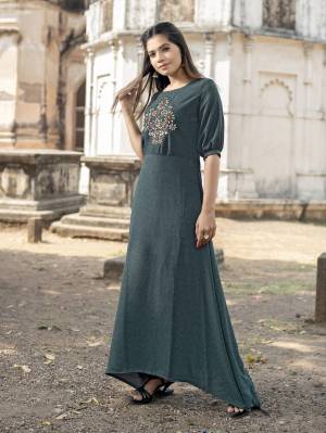 Flaunt Your Rich And Elegant Taste In This Lovely Readymade Dark Grey Colored Long Kurti Fabricated On Cotton. It Has Beautiful Hand Work Patch Over Its Yoke With New Pattern Sleeves. 