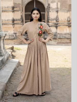 Simple And Elegant Looking Designer Readymade Long Kurti Is Here In Beige Color Fabricated On Cotton. It Has One Side Multi Colored Thread Work Giving The Kurti An Enhanced Look.