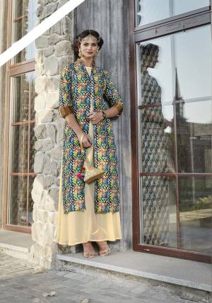 Go Colorful With This Lovely Designer Readymade Kurti In Beige And Multi Color Fabricated On Satin Beautified With Intricate Geometric Prints All Over It. 