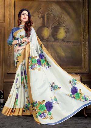 Simple Saree If Here For Your Semi-Casual Wear In White Color Paired Blue Colored Blouse. This Saree And Blouse Are Silk based Beautified With Prints All Over It. 