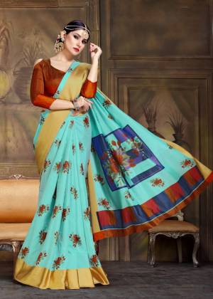 New Color Pallete Is Here With This Designer Saree In Aqua Blue Color Paired With Contrasting Rust Orange Colored Blouse. This Saree And Blouse Are Fabricated On Art Silk Beautified With Contrasting Floral Prints All Over It. 